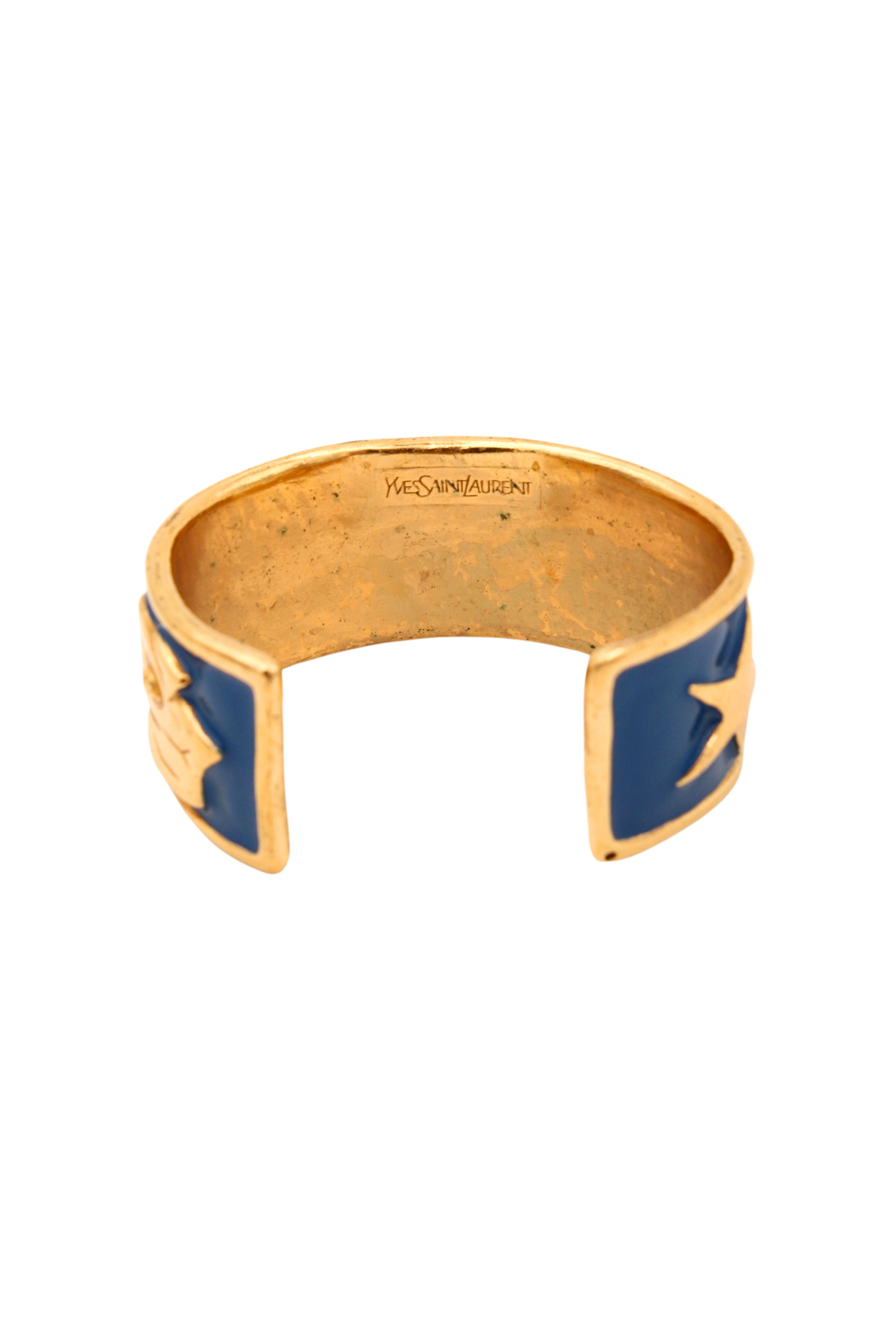 Yves Saint Laurent <br> 80's gold plated enamel logo bangle