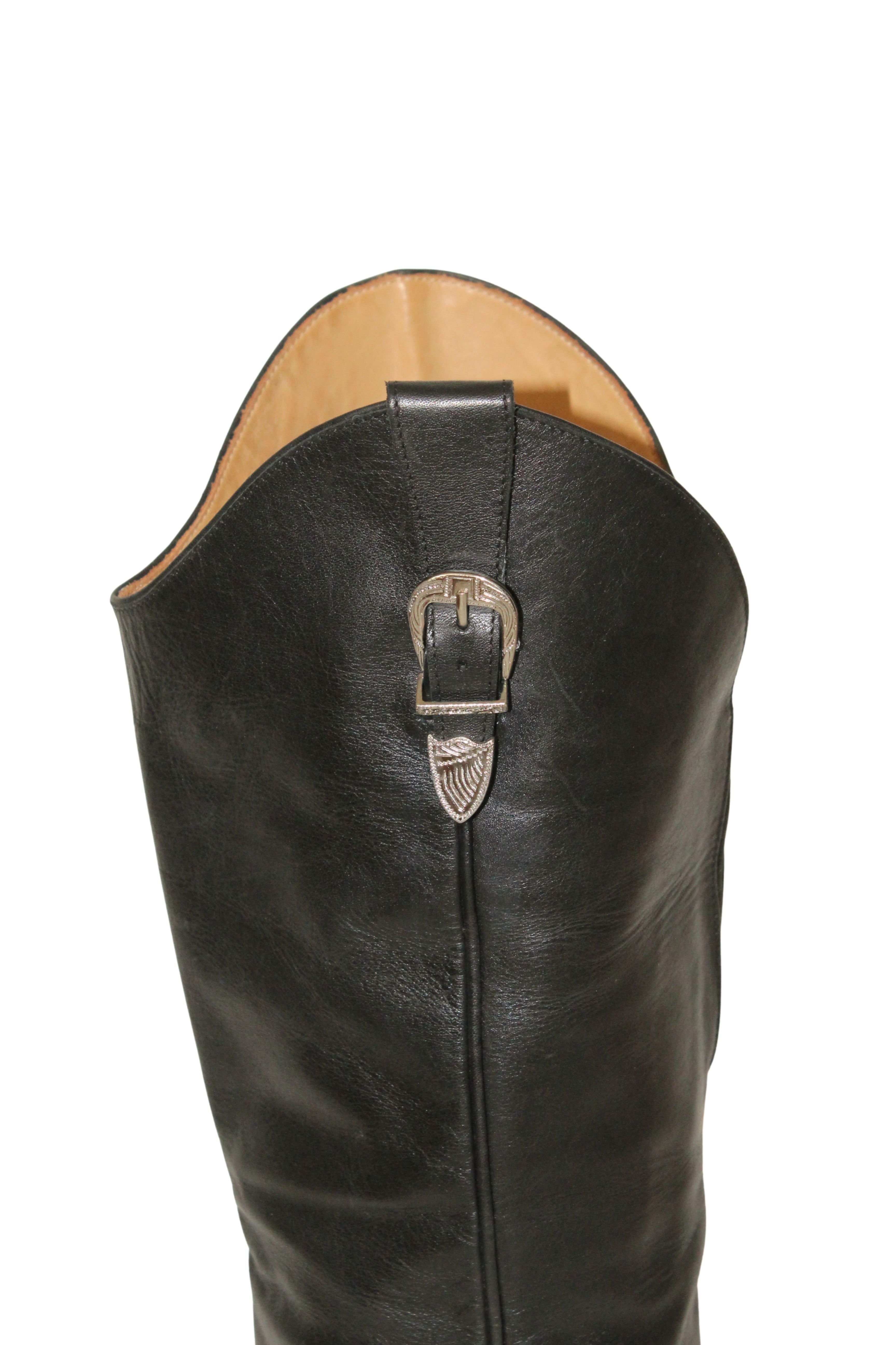 Toga Pulla <br> Thigh high leather cowboy boots with silver hardware