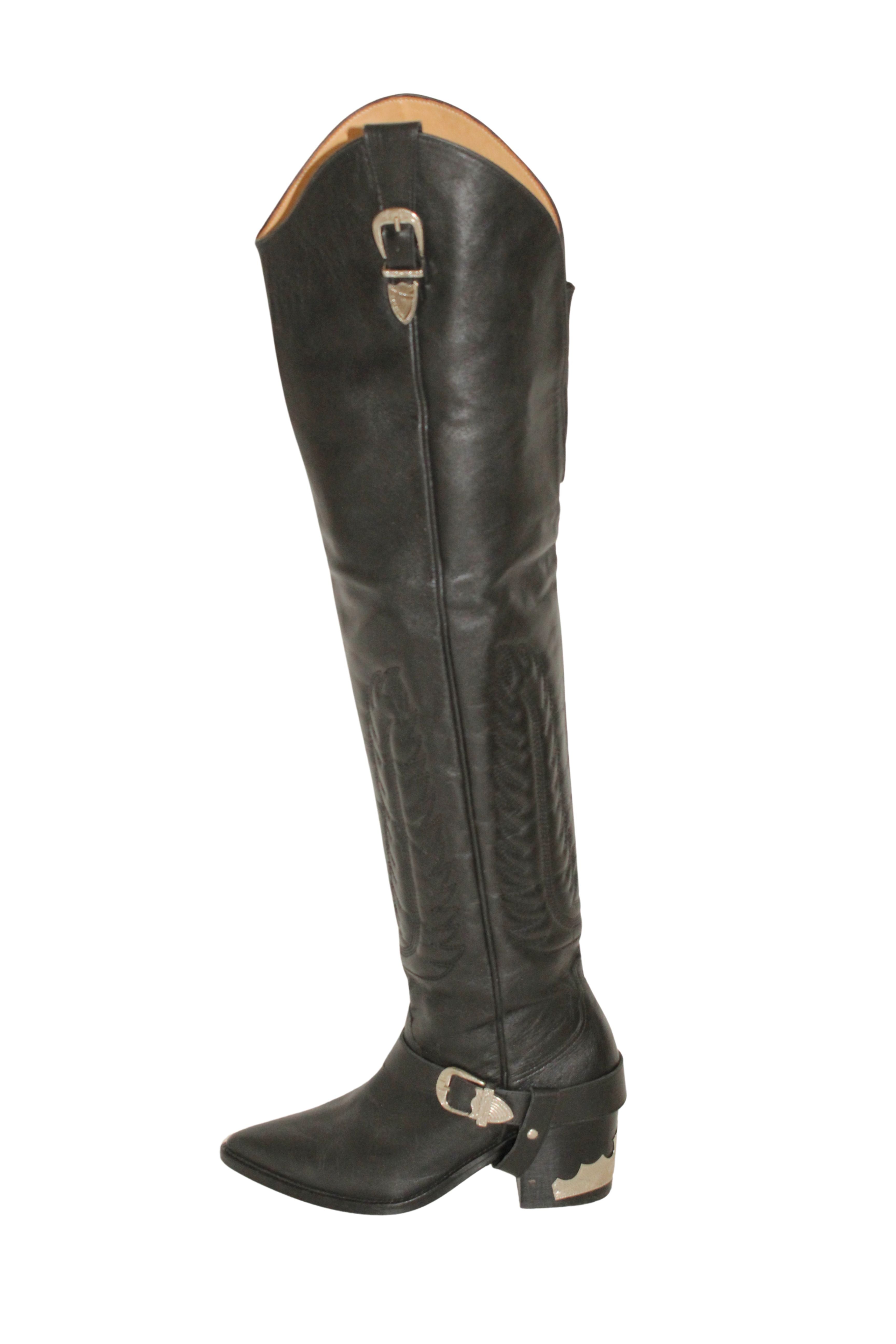 Toga Pulla <br> Thigh high leather cowboy boots with silver hardware