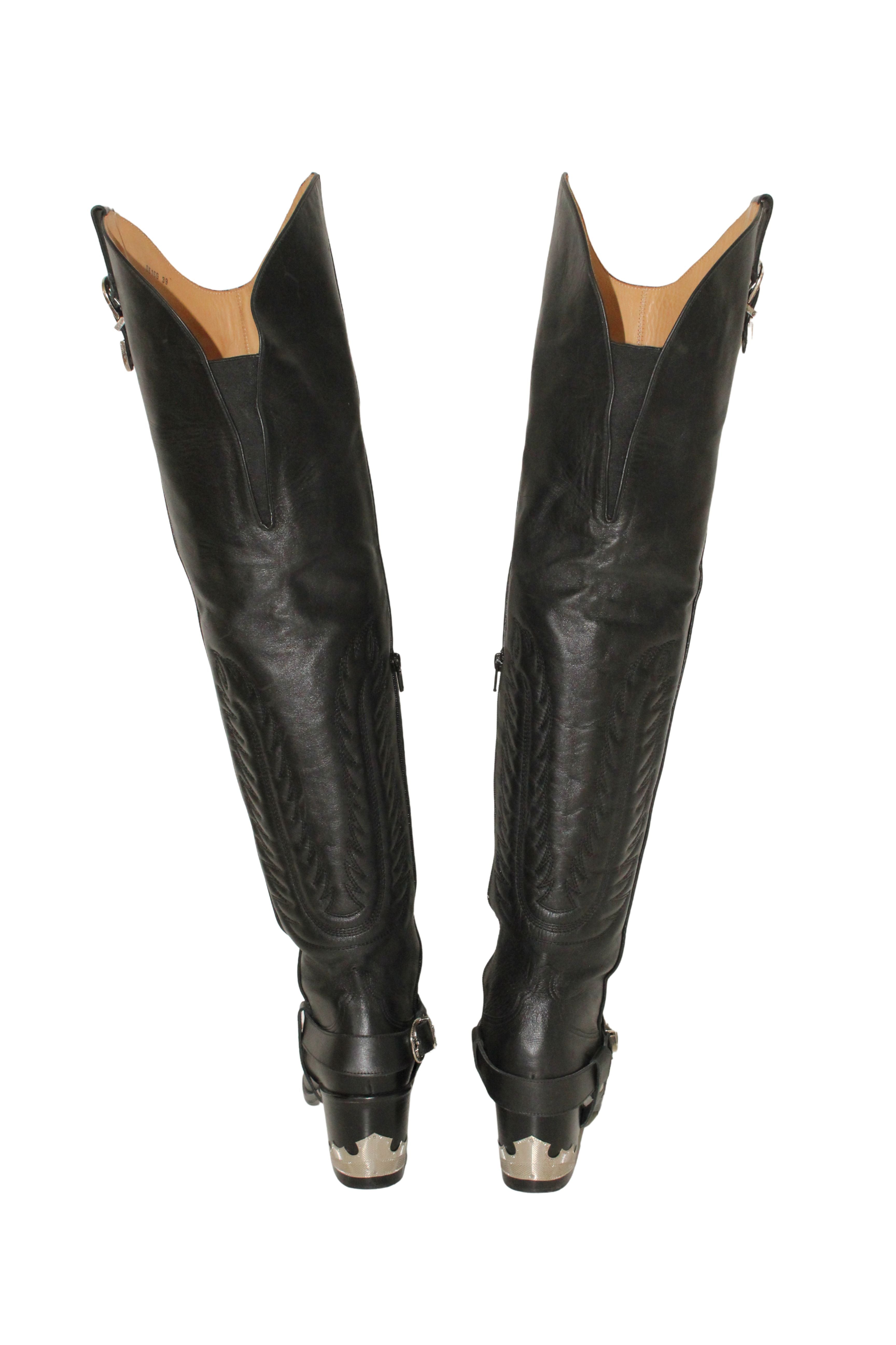 Toga Pulla <br> Thigh high leather cowboy boots with silver hardware