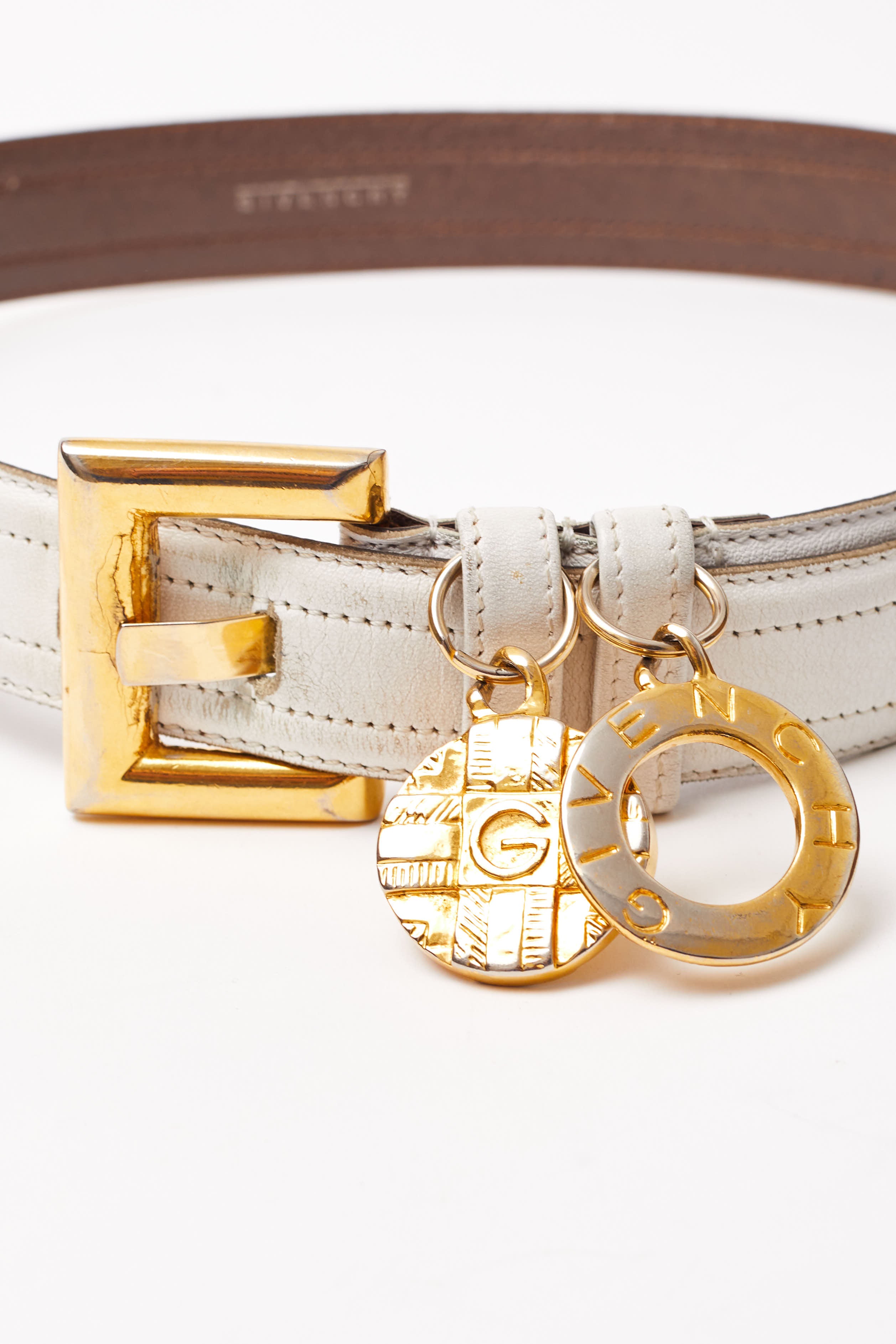 Givenchy <br> 80's leather belt with dangling logo medallions